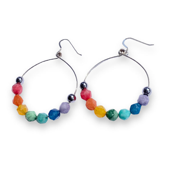 Silver hoop earrings with rainbow colored quartz beads and silver beads on both ends.